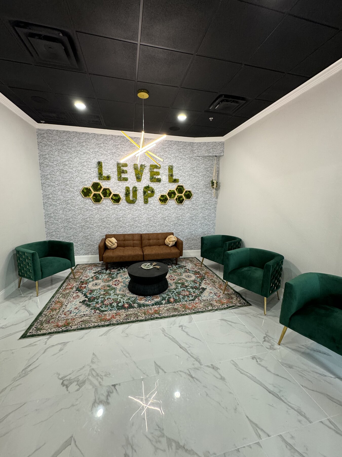 Level Up Health waiting lounge with green seating